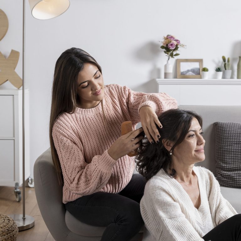 high-angle-girl-braiding-mom-hair