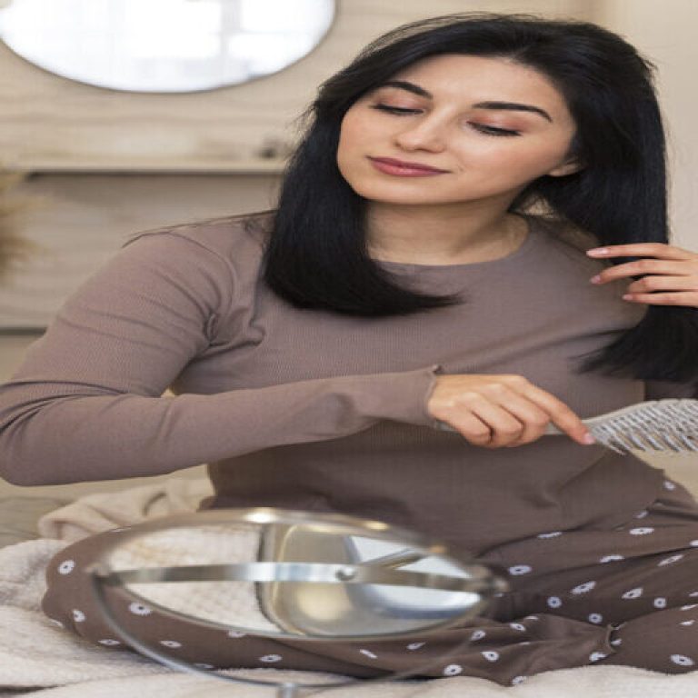 woman-combing-hair-her-beauty-routine-768x1152 (2) (1) (1)